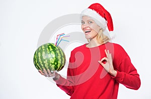 Strengthen immunity concept. Girl wear santa hat drink watermelon vitamin cocktail straw. Woman enjoy vitamin drink