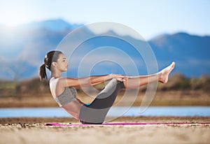 Strengthen your core. Shot of a young woman exercising outdoors.