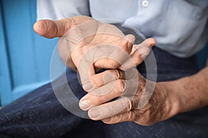 Strengthening exercise for finger health of Asian elder patient with muscle spasm