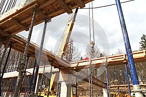 Strengthening the foundation of the second floor of the house with metal racks