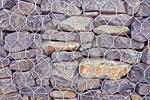Strengthening a stone wall, background with bricks