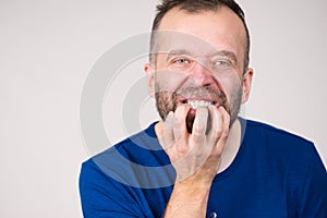 Man biting his nails