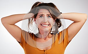 Stress, anxiety and portrait of scared woman in studio with fear, fail or overthinking on grey background. Trauma, panic