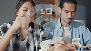 Stress asia couple man and woman use calculator for calculate family budget, debts, monthly expenses during financial economic