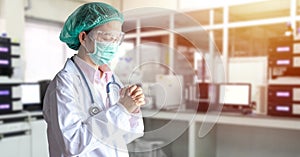 Stress Asian doctor in uniform suit, medical mask and cap make a praying in hospital during transmission of Covid-19 coronavirus