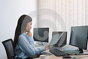 Stress asian woman while coding data programmer on desktop PC while working on computer codes in the office