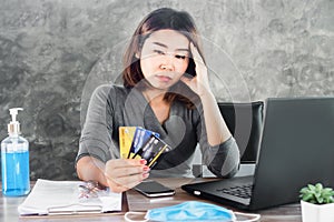 Stress Asian woman with financial problem ,debt during covid-19 virus pandemic