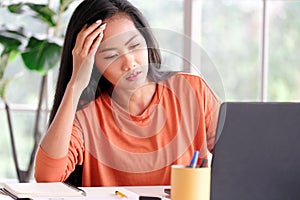 Stress asian woman struggle with laptop computer, Frustrated female at home office desk, People struggle with technology, Asia