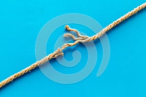 Stress concept with breaking rope on blue background top view mockup