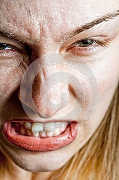 Stress concept - closeup on angry displeased woman