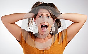 Stress, fear and woman face shouting in studio for anxiety, fail or overthinking on grey background. Trauma, panic or