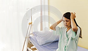 The stress of the female patient treating the sick in the hospital