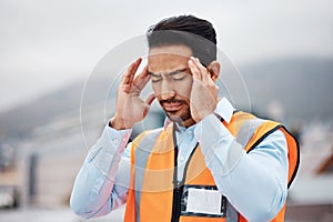 Stress, headache and male construction worker on a rooftop of a building for inspection or maintenance. Migraine