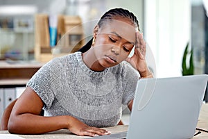 Stress, headache and sick black woman in office with pain, fatigue or burnout by laptop in creative business startup
