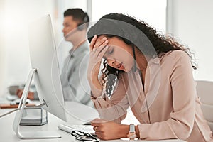 Stress, headache and woman telemarketing consultant with computer in office with burnout for crm. Migraine, exhausted