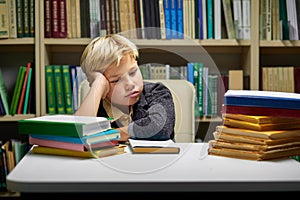 stress and tired child under mental pressure while reading books preparing examinations