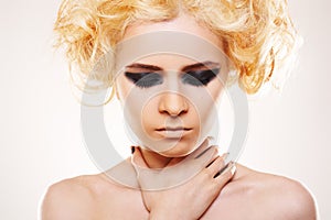 Stress. Woman with blond hair and rock make-up