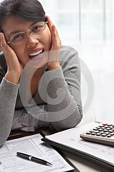 Stress woman with tax form