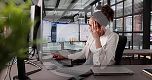Stressed Accountant Analyzing Financial Data On Computer Screen
