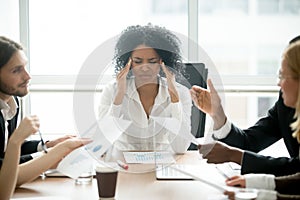 Stressed african businesswoman tired or suffering from headache