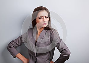 Stressed angry business woman in suit looking