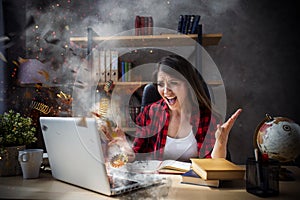 Stressed and angry girl with explosed computer due to overwork