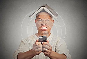 Stressed angry man poking at his smart phone