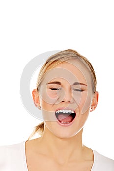 Stressed or angry young woman screaming