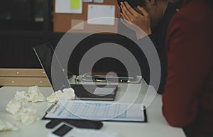 Stressed annoyed office employee manager having headache migraine at business meeting with his colleagues about business problem