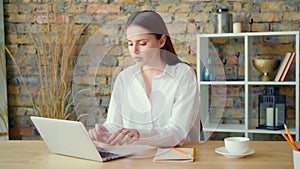 Stressed and annoyed young businesswoman walks away in rage out of her desk