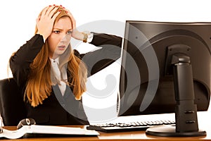 Stressed anxious business woman stare in monitor in her office