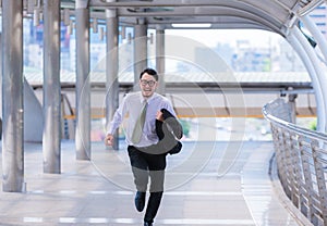 Stressed anxious businessman in a hurry and running, he is late for his business appointment and Wear a shirt while running.