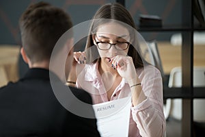 Stressed applicant nervous at job interview while hr reading res