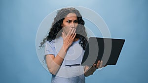 Stressed Arabian woman Hispanic girl shocked astonish dissatisfied confused Arabian female upset with laptop failure photo