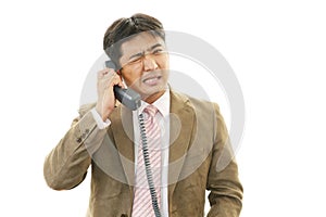 Stressed Asian businessman