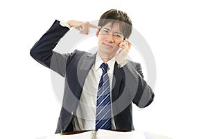 Stressed Asian businessman