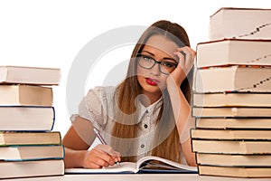 Stressed asian caucasian woman student learning in tons of books