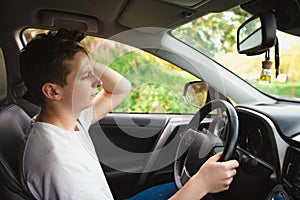 Stressed and bewildered driver, pissed off keeps hands to head, has traffic problems. Unlucky man has a road accident