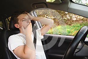 Stressed and bewildered driver, pissed off keeps hands to head, has traffic problems. Unlucky man has a road accident