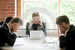 Stressed boss executive team searching business problem solution photo