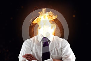 Stressed business man with burning head