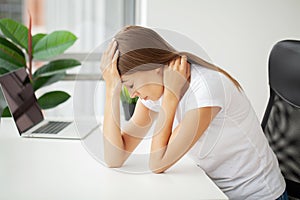 Stressed Business Woman Holding Her Head With Hand In