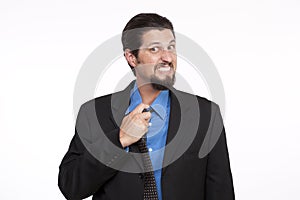 Stressed businessman adjusting his necktie