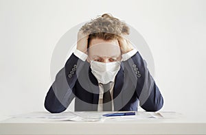 Stressed Businessman in Face Mask. Lockdown Coronavirus