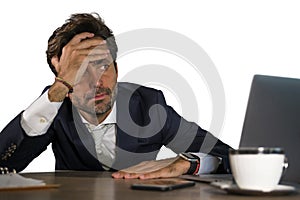 Stressed businessman feeling depressed and overwhelmed working at office computer desk tired and exhausted defeated by business f