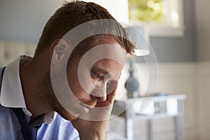 Stressed Businessman Getting Dressed For Work