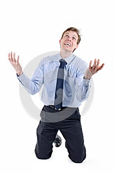 Stressed businessman on knees