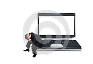 Stressed businessman on laptop