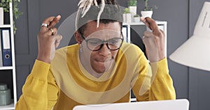 Stressed businessman receiving bad news on laptop