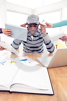 Stressed businessman sitting at desk